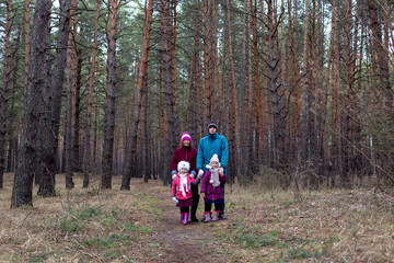 Fototapeta premium Rural family in autumn forest