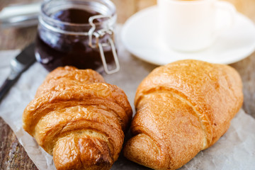 Two croissants and a cup of coffee