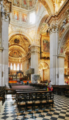 Fototapeta na wymiar Bergamo, Italy - August 18, 2017: Bergamo's Basilica di Santa Maria Maggiore, ornate gold interior.