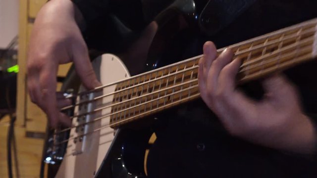 Bass guitar.Lessons of guitar playing.     