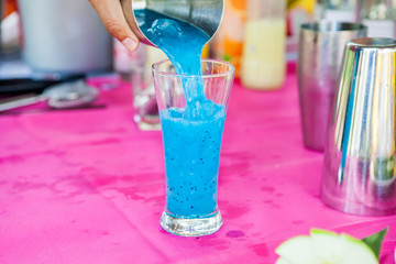 making alcohol cocktail.blue dragon fruit cocktail
