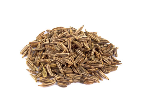 Cumin seeds or caraway isolated on white background
