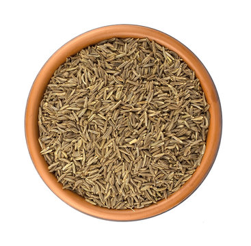 Cumin seeds or caraway isolated on white background