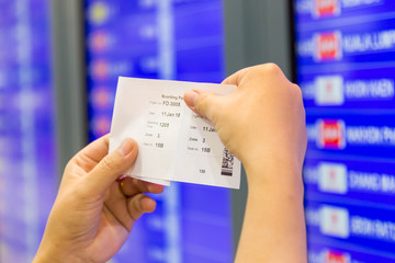 passenger  in airport look at flight timetable