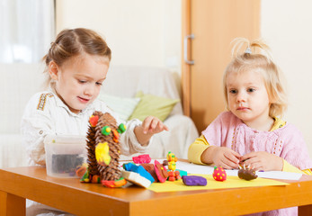 Fototapeta premium girls playing with plasticine