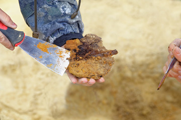 A rare archaeological find in the hands of archaeologists