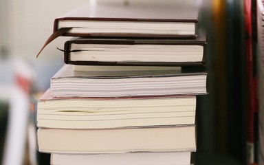 Pile of study books closeup blur background