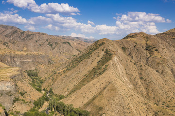 Fototapeta na wymiar Mountain tops in the summer clear afternoon. Armenia