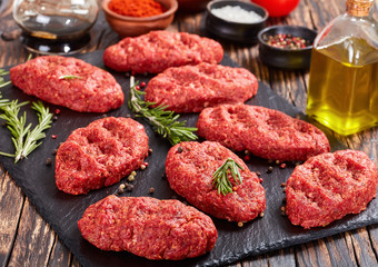 salisbury beef steak on black stone plate