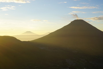Silhouette of Prau mountain after sunrise. Dieng Plateau, Indonesia.