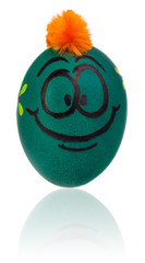 Easter egg, painted in smiling cartoon face of guy. Decorated egg with funny colorful hairstyle and multi-colored patterns.