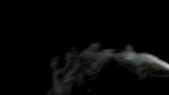 smoke coming from the right side against black background