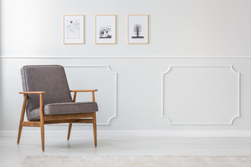 Grey wooden armchair in interior