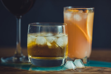 Alcohol drinks on dark solid background 