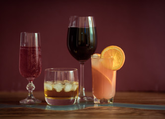 Alcohol drinks on dark solid background 
