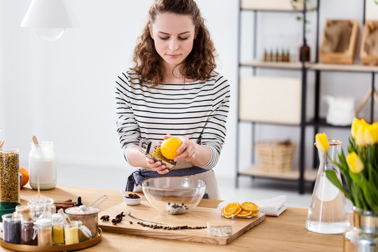 Girl peeling orange