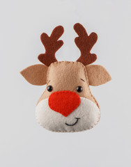 Handmade Christmas toys. deer of felt on white background. Space for text