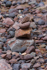Stone pyramid on pebble beach