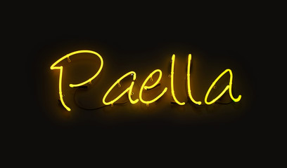 Close up PAELLA yellow neon light sign over black