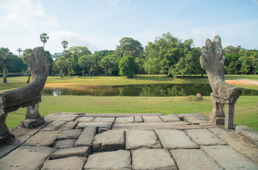 The Nagas statue on the steps down from the causeway of Angkor Wat in Siem Reap of Cambodia.
