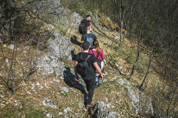 Obraz premium Group of hikers going down a hill.