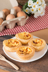 Egg tart on wood table.
