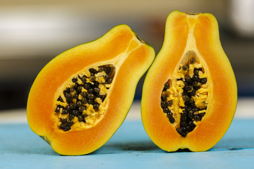 Closeup of a papaya fruit over blurred background