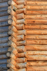 Corner of a wooden blockhouse and its walls in ancient Russian style