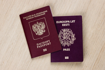 two passports on the table. dual citizenship of Estonia and russia, europe