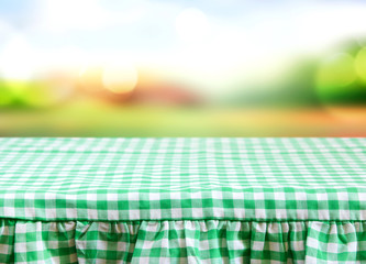 Green white checkered tablecloth with abstract backround summer