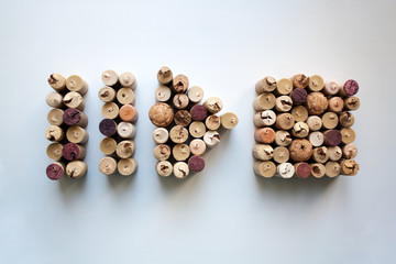 Wine corks pause, play and stop button shapes isolated on white background from a high angle view