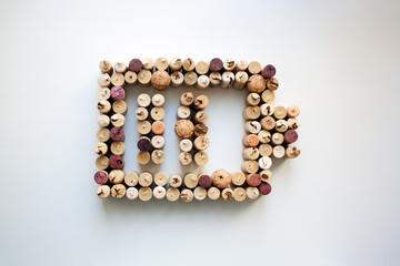 Wine corks battery charge level abstract composition isolated on white from a high angle view