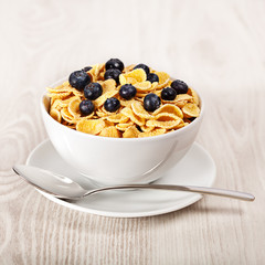 Corn flakes with blueberries breakfast