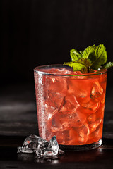 Juicy grapefruit drink on dark table