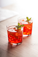 Fototapeta na wymiar Red cold summer cocktail drink