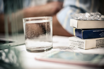 Pill on desk.