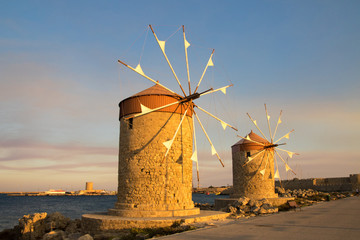 Two traditional windmill in Mandraki port of Rhodes,Greece