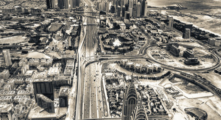 Aerial view of Downtown skyline along Zayed Road from helicopter. The city attracts 30 million tourists annually