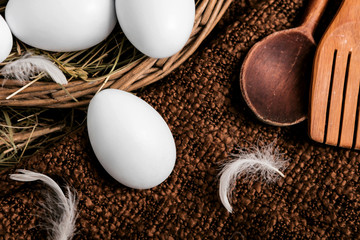 Egg outside a basket
