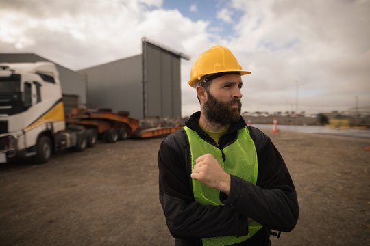 Dock worker standing in shipyard