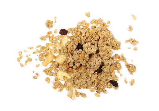 Crunchy granola, muesli pile with banana, pineapple slices, peanuts and raisins isolated on white background