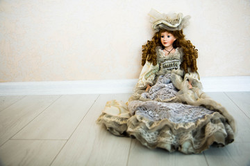 Doll and flowers on a white background. Free space.