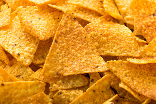 Hot Spicy Sriracha Potato Chips With Pepper On Isolated White Background