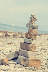 Pebbles zen tower at sea shore.