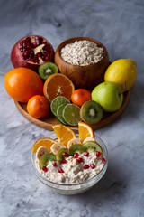 Breakfast still life with oatmeal porridge and fruits, top view, selective focus, shallow depth of field.