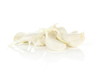 Young garlic separated cloves stack isolated on white background.