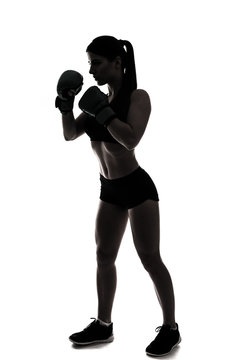 One caucasian woman boxing exercising in silhouette isolated on white background