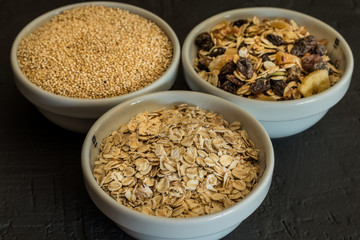 Quinoa, brown rice and oats. Healthy whole grain cereals. Vegan food concept