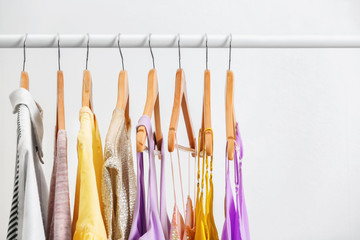 Different clothes on hangers, indoors
