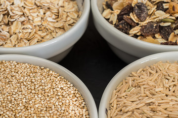 Quinoa, brown rice and oats. Healthy whole grain cereals. Vegan food concept